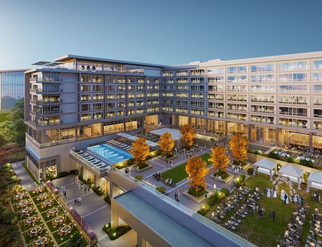 The image shows a modern hotel or apartment complex with a central courtyard featuring a swimming pool, garden, seating areas, and tents for events.