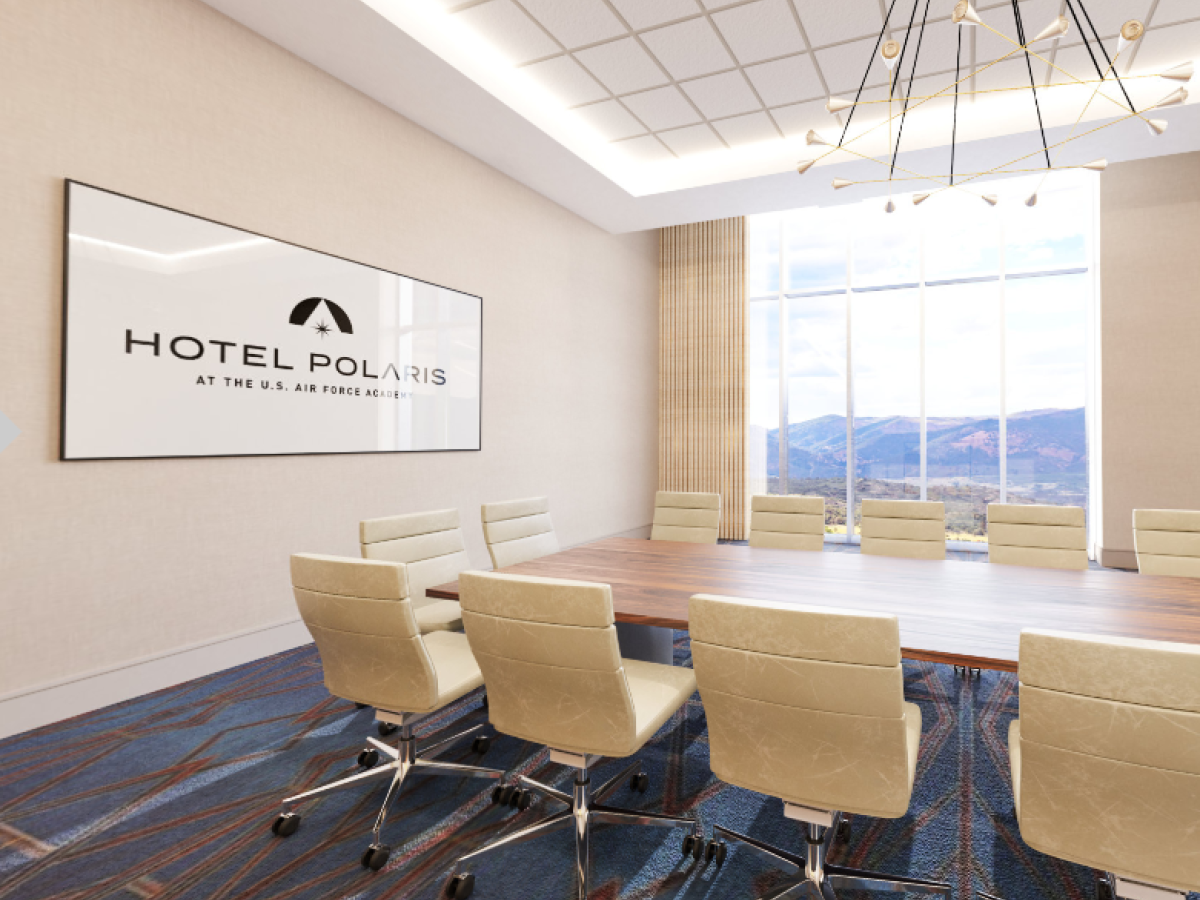 The image shows a modern conference room in Hotel Polaris, with a large window offering a mountain view, white chairs, a wooden table, and a ceiling light.